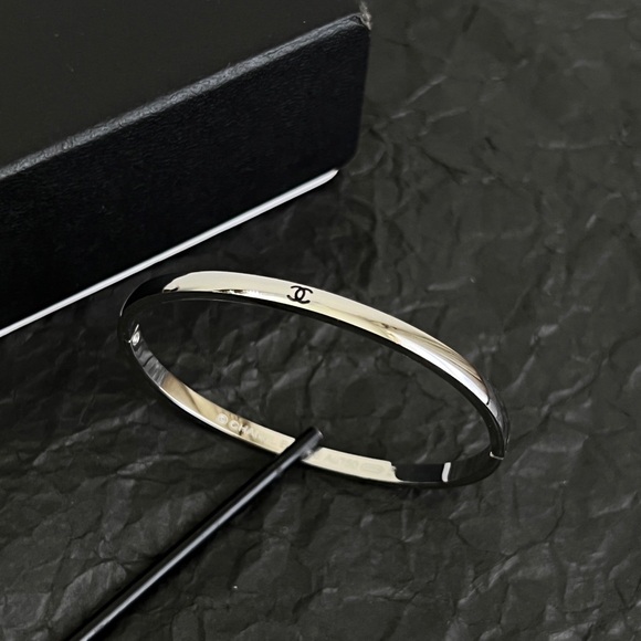 chanel. Jewelry - Chanel Silver-Tone CC Logo Open Cuff Bangle Bracelet